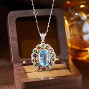 Detailed view of an S925 silver necklace with a blue topaz and colorful gemstones