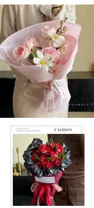 Close-up detail of elegant pink bouquet wrapping fabric with pearl edge decoration.