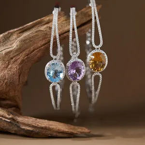 Close-up of S925 silver bracelets with blue topaz, amethyst, and citrine gemstones