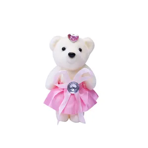 Mini white plush teddy bear doll with pink skirt and heart jewel for gift bouquets