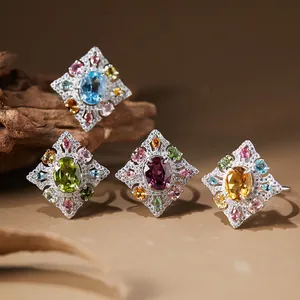 Detailed view of four s925 silver rings with various natural colored gemstones