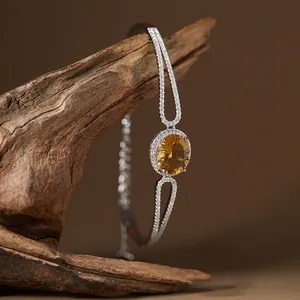 Detailed macro view of S925 silver bracelet with a brilliant oval yellow citrine stone