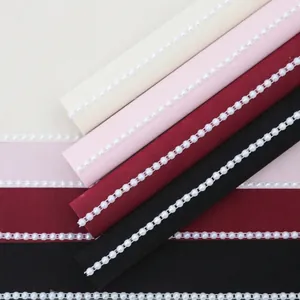 Hepburn style bouquet wrapping paper with elegant pearl trim and fabric texture