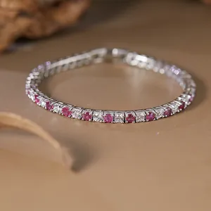 Close-up of an elegant S925 silver tennis bracelet with pink and clear gemstones
