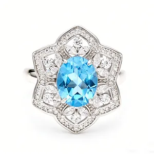 Detailed close-up of an S925 sterling silver ring featuring an oval blue topaz center stone.