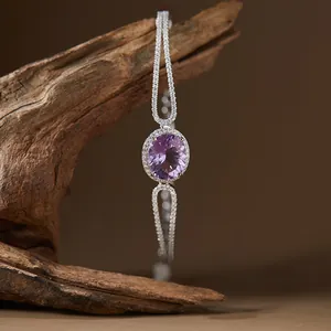 Detailed view of an elegant S925 silver bracelet featuring a large oval purple gemstone