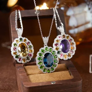 Elegant S925 sterling silver necklace featuring oval blue topaz, amethyst, and citrine pendants.