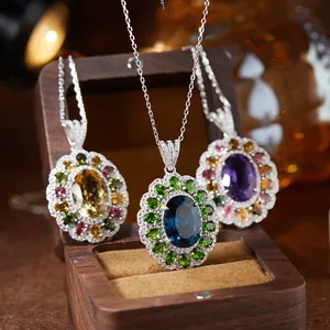 Detail view of S925 silver necklaces with natural topaz and amethyst pendants