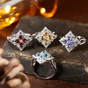 Macro view of four vintage S925 silver rings with various colored natural gemstones