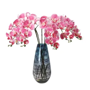 Orchidee Phalaenopsis rosa stampate in 3D realistiche in un vaso di vetro blu sagomato