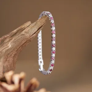 Close-up detail of S925 silver tennis bracelet with red rubies and white stones