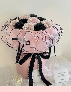 Elegant pink ballet style bouquet wrap featuring black pleated tulle and scalloped ribbon