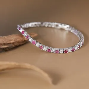 Elegant close-up of S925 silver tennis bracelet featuring red and white round cut gemstones