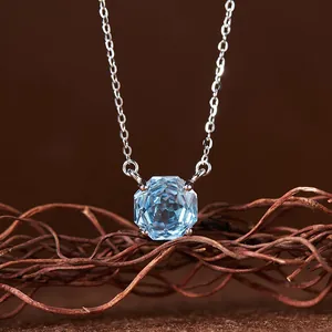 Close-up macro detail of light blue octagonal topaz pendant on a fine S925 silver chain