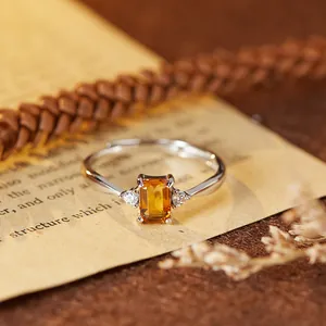 Detailed view of an S925 sterling silver ring featuring a natural emerald-cut citrine gemstone