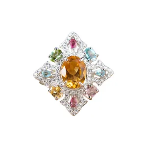 Macro view of multi-colored natural gemstone ring in s925 silver vintage setting.