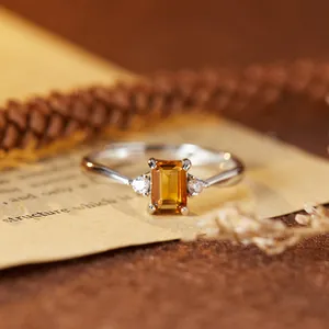 Close-up detail of emerald-cut natural citrine ring in S925 sterling silver setting.
