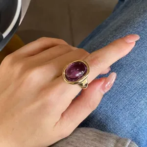 Macro detail of a vintage oval amethyst bathtub ring with 24k gold plated sterling silver
