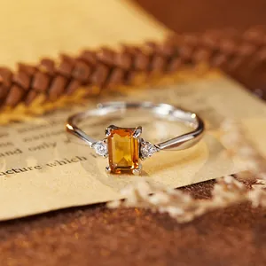 Close-up of an elegant S925 sterling silver ring featuring a rectangular citrine stone