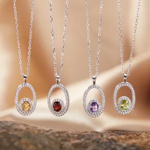 Close-up of four S925 silver necklaces featuring oval natural gemstones in multiple colors