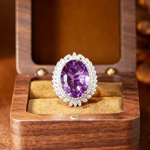 Exquisite detailed macro shot of a large oval purple amethyst ring in wooden box