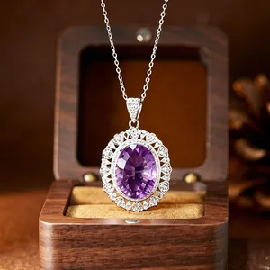 Exquisite close-up of a large oval amethyst pendant necklace on a silver chain