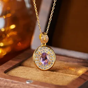 Close-up of elegant purple amethyst pendant necklace in luxury wooden box display