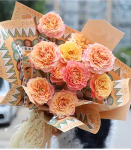 Detail view of Dunhuang Three Rabbits themed floral wrapping paper with orange roses