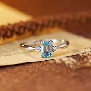 Macro view of a rectangular light blue topaz set in a s925 sterling silver ring