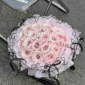 Elegant ballet style puff mesh bouquet wrapping material with black ruffled edges and ribbons