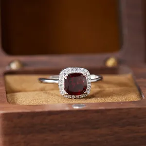 Close-up detail of a cushion-cut red gemstone ring in S925 sterling silver setting
