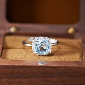 Detailed view of the S925 silver cushion-cut blue gemstone ring in a wooden box