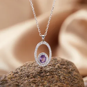 Close-up of an S925 silver necklace with an oval amethyst pendant and halo diamonds