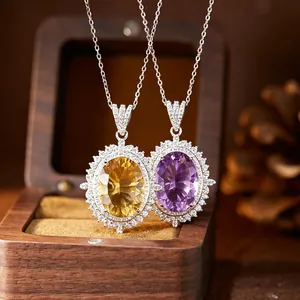 Close-up of oval citrine and amethyst pendant necklaces with sparkling halo settings