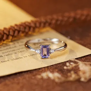 Close-up of a rectangular purple gemstone set in an S925 sterling silver ring band