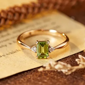 Macro view of an elegant emerald-cut green gemstone ring set in S925 sterling silver