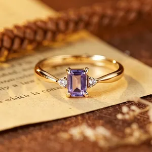Macro view of an elegant gold-plated silver ring with a rectangular purple amethyst