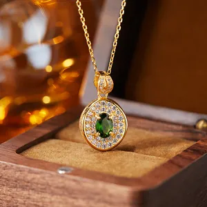Close-up of elegant gold plated S925 silver necklace with green diopside pendant