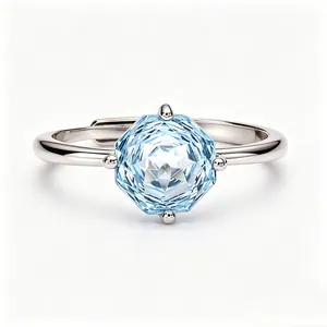 Detail shot of a S925 silver ring featuring an octagonal light blue topaz stone
