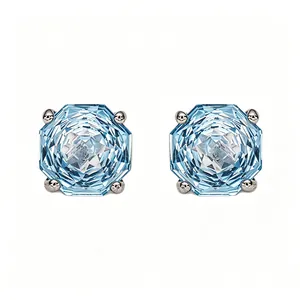 Detailed macro view of S925 sterling silver stud earrings with octagonal blue topaz gems