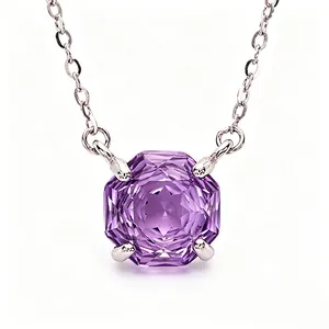 Detailed view of an octagon-cut purple amethyst gemstone pendant on a silver chain necklace
