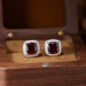 Detailed view of S925 sterling silver cushion-cut red gemstone halo stud earrings