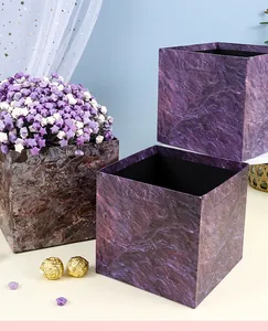 Detail view of purple marble textured square gift box set for flower arrangement