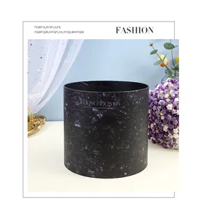 Detail view of round dark purple marble pattern flower bucket gift box for bouquet