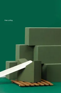 Close-up detail showing the cuttable texture of green absorbent floral foam blocks