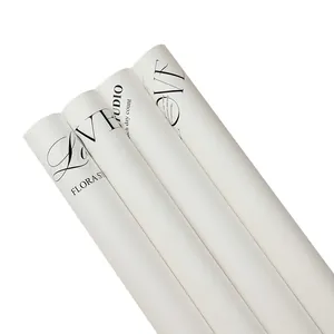 White flower wrapping paper rolls with 'LOVE' and 'FLORA' English letter designs