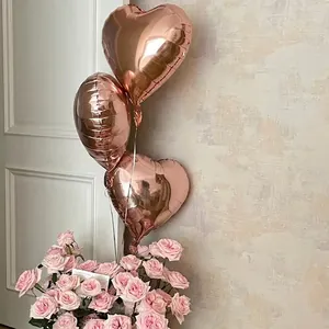 Elegant rose gold heart-shaped foil balloons for wedding and romantic party decorations.