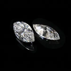 Detailed close-up of two sparkling D color marquise-cut moissanite stones with VVS clarity
