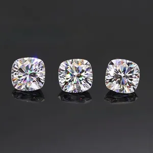 Macro view of three cushion-cut Moissanite gemstones showing brilliant fire and sparkle