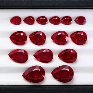 Macro view of faceted pear-cut synthetic pigeon blood rubies showing detailed facets.